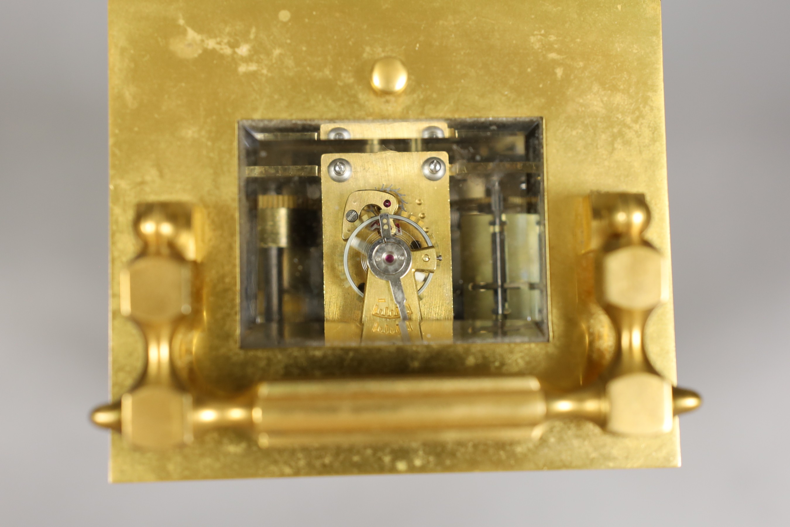 A French repeating carriage clock with alarm and with inlaid scroll decoration, with key, 19cm tall